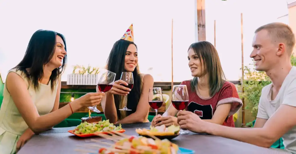 Group of friends enjoying drinks at a brunch table in Dubai highlighting social drinking culture